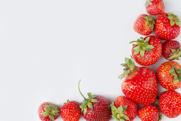 frame of ripe strawberries, white background, copy space