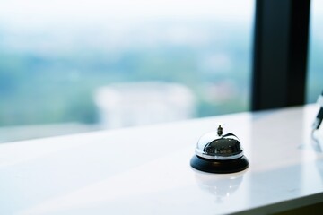 Hotel reception counter desk with service bell. front desk bell for call staff service.