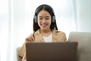 Start up Confident young asian business woman working in webcam group video call conference technology .