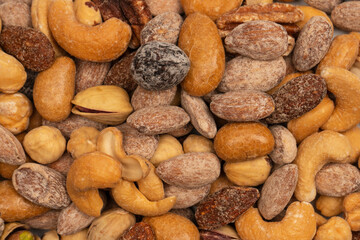 A group of almonds, pistachios, walnuts, macadamia, cashews.