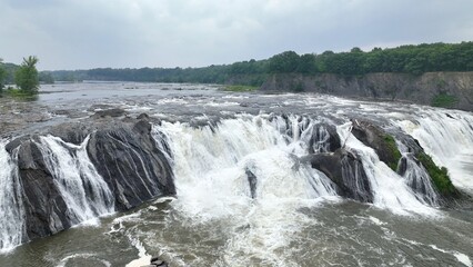 Natural waterfall wonder and tourist attraction Cohoes Falls where Mohawk river plunges over spectacular cliffs