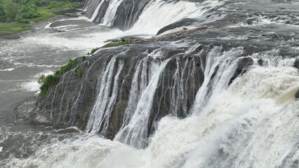 Rapids of Cohoes waterfall on Mohawk river in New York State natural wonder and tourist attraction with visitor overlook in Waterford, NY near Albany