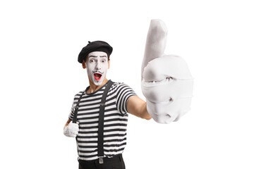 Obraz na płótnie Canvas Cheerful mime gesturing a thumb up sign