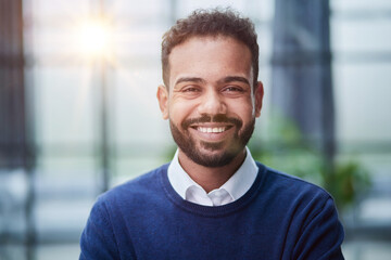 Fototapeta premium Smiling millennial confident black guy posing for photo, looking at camera