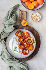 Grilled apricots with buratta cheese
 and honey. Summer breakfast	