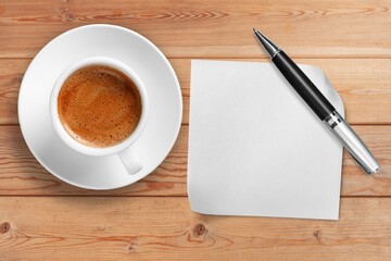 White napkin with a hot cup of coffee