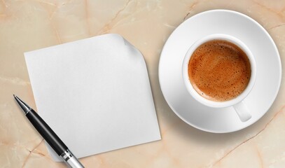 Obraz na płótnie Canvas White napkin with a hot cup of coffee