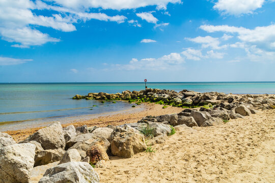 Hengistbury Head, UK - July 1st 2023: Rock Groyne on Mudeford Sandbank beach.
