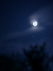 amazing cloudy sky and the moon behind it , July,3,2023 : Rampur Uttar Pradesh India.