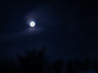 amazing cloudy sky and the moon behind it , July,3,2023 : Rampur Uttar Pradesh India.