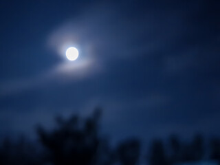 amazing cloudy sky and the moon behind it , July,3,2023 : Rampur Uttar Pradesh India.