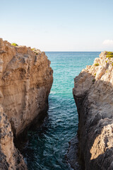 Fototapeta na wymiar Italy, July 2023: wonderful and relaxing view of the bay of Riaci with its cliffs and crystalline sea. We are near Tropea along the Costa degli Dei in the Calabria region