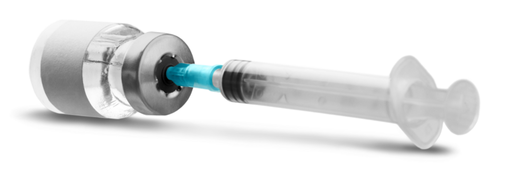 Covid-19 vaccine bottle with a blue liquid and taking the vaccine from it with a syringe