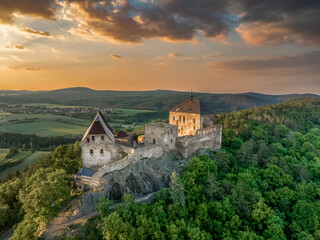 Fototapeta na wymiar Aerial view of Zebrak castles on opposite hillsides from Tocnik in Bohemia during sunset