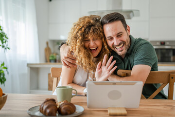 couple husband and wife man woman use digital tablet for video call