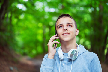 photo boy with a mobile phone in various poses, the concept of modern life