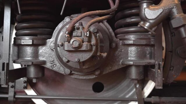 huge steel black locomotive wheels with lever syste