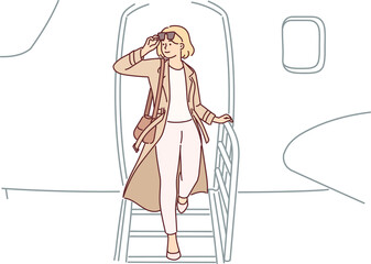 Woman gets off airplane, having arrived on business trip on private flight to conclude contract