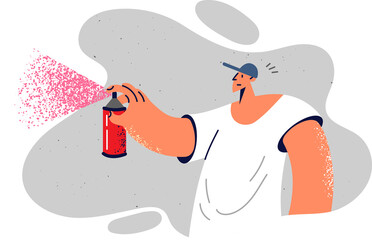 Man paints graffiti using spray paint to walls and gets carried away by street art subculture