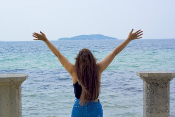 woman standing on the beach