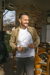 One man stand at his house in sunny day or morning enjoy cup of coffee
