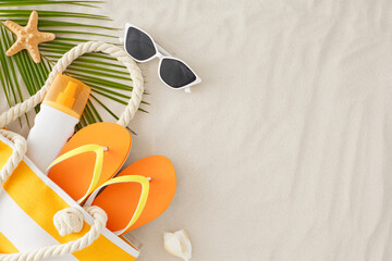 Concept of a beachside summertime vacation. Top view flat lay of sunscreen bottle, beach bag,...