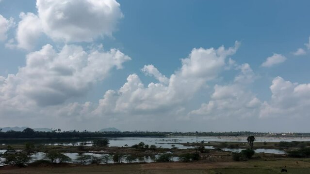 Time lapse of clouds over lake Samudiram Eri in Southern India. 