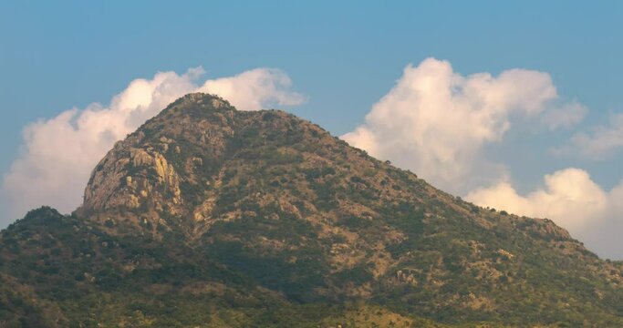 Arunachala, holy hill located in Tiruvannamalai, Tamil Nadu, India. Sunrise Time lapse Telephoto