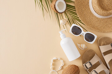 The concept of a sandy summer getaway. Top view arrangement of cosmetic pump bottle, sandals, hat,...