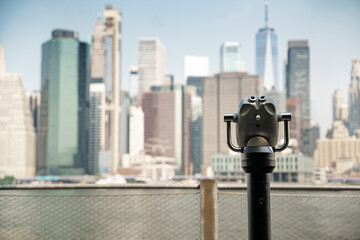 Binoculars of brooklyn park with manhattan in background.