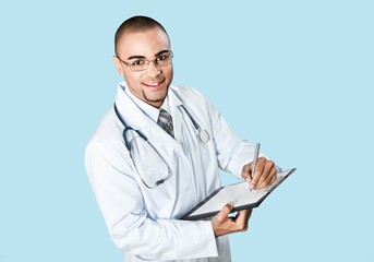 Portrait of handsome young doctor posing