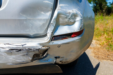 Vehicle damaged in a car accident, broken rear bumper, damaged components - 619580614