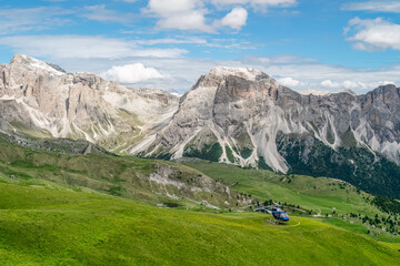 Fototapeta na wymiar Helicopter in the rocky Dolomites of Italy.