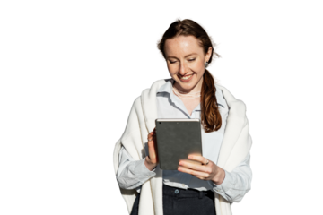 A female assistant employee is using a tablet smiling in formal attire working in an office. Transparent background, png.