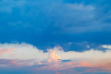 Sky is sunset with overcast clouds and gaps