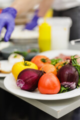 Fresh tomatoes and vegetable on the table
