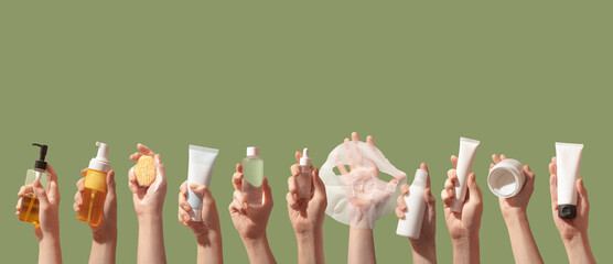 Korean care system cosmetic bottles, jars, tubes green background. Peeling, cleansing oil, mask,...