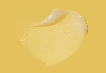 White transparent face mask or peeling gel on banana lemon yellow background