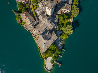 Romantic island of San Giulio in Orta lake, Piedmont, Italy. Aerial view lake Orta. 