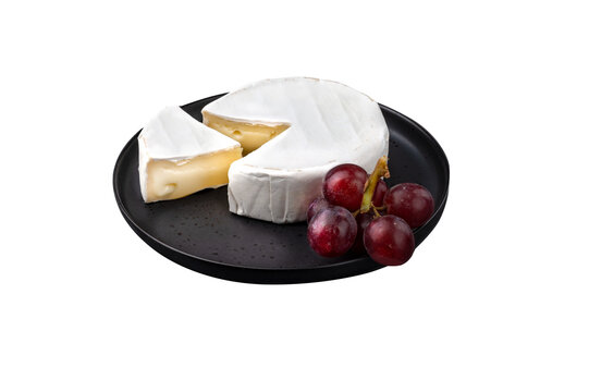 Camembert cheese on plate with fruits on transparent background