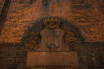 Brick Wall Ornamentation: An exquisite display of architectural artistry. A weathered brick facade...