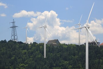 Wind energy and power concept. Wind turbines on nature background