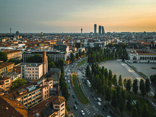 Drone photography of the city and the entrance to the monumental cemetery of Milan. Drone photography of Milan at sunset