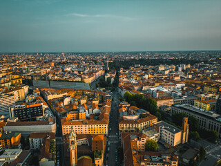 Drone photography of the city and the entrance to the monumental cemetery of Milan. Drone photography of Milan at sunset
