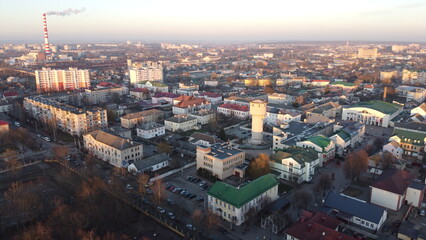 Fototapeta na wymiar Aerial view of residential areas of Belarusian city of Baranavichy on winter morning, Brest Region