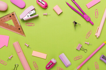 Pink school stationery on color backgroung, top view