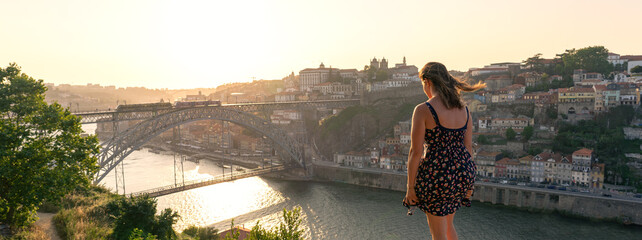 dom luiz brige in Porto on the riverside of Duero river cityscape at sunset from above - obrazy, fototapety, plakaty