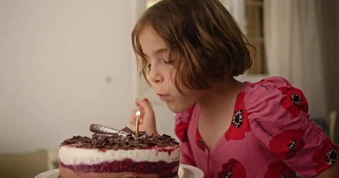  An Adorable Birthday Blunder Captivating Footage of a Child Accidentally Leaving the Candle Lit on the Cake. High quality 4k footage