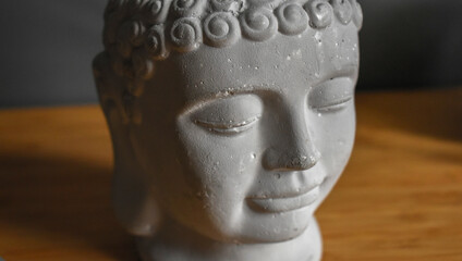 Laughing buddha statue. Living room interior decor. Selective focus. 