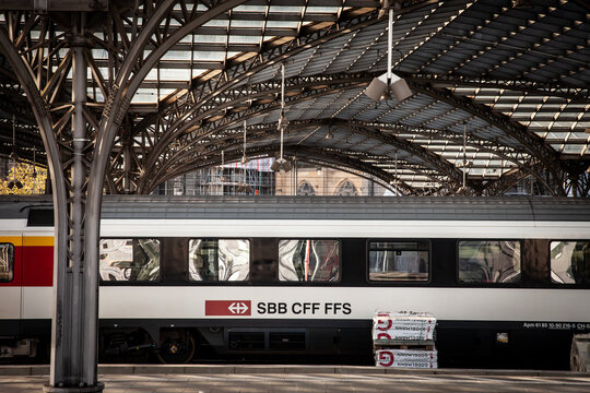 COLOGNE, GERMANY - NOVEMBER 12, 2022: Passenger train with swiss railways logo of SBB CFF FFS in international train in Koln HBF, Cologne main train station. it's the main train carrier of Switzerland